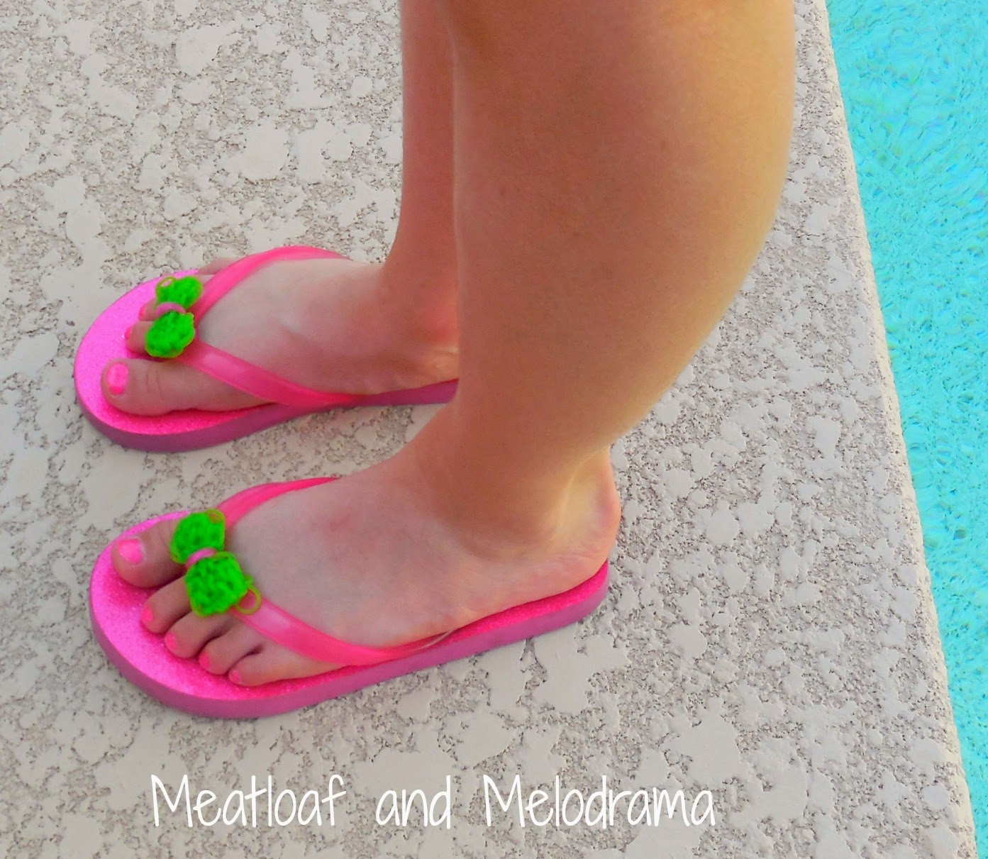 pink flip flops with rainbow loom bows by the pool