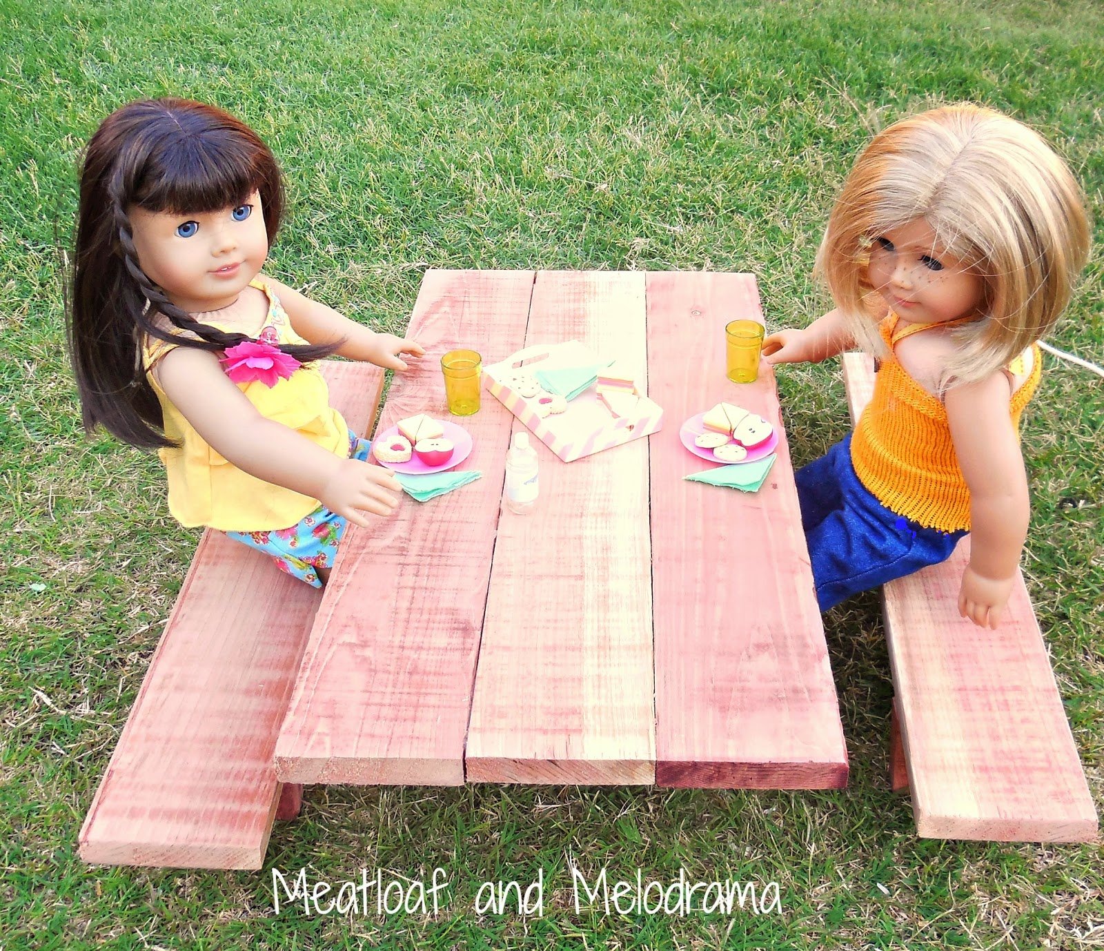 ag dolls having picnic on picnic table