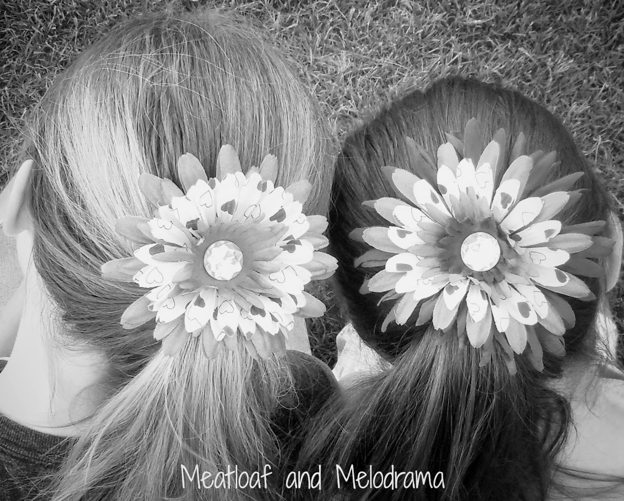 two girls with flowers in their hair