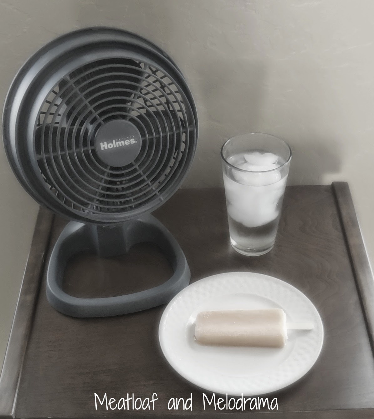 portable fan, ice water and popsicle frozen treat