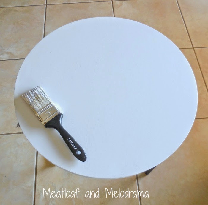 round nesting table painted with spray paint and latex paint