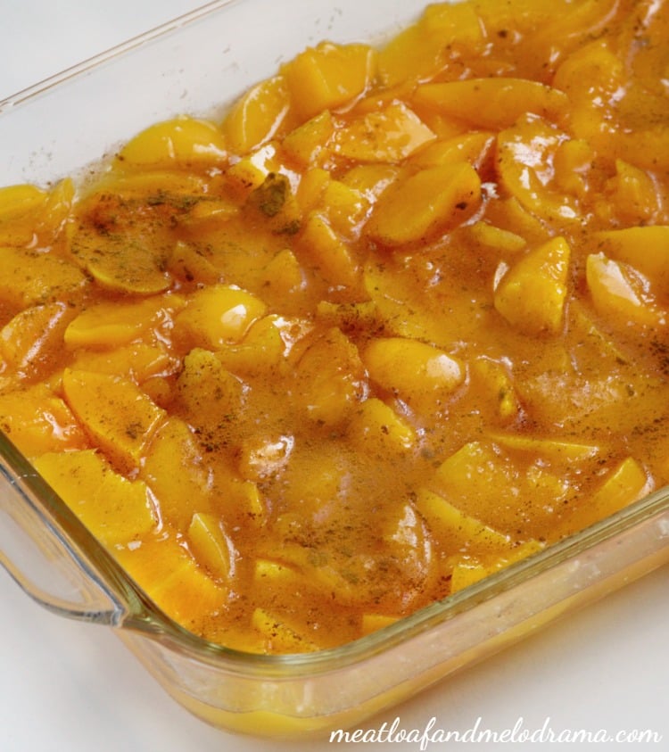canned peaches with cinnamon in baking pan