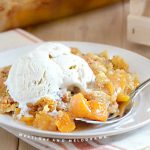 peach cobbler with cake mix topping and ice cream