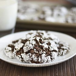 easy chocolate crinkle cookies with powdered sugar on white plate