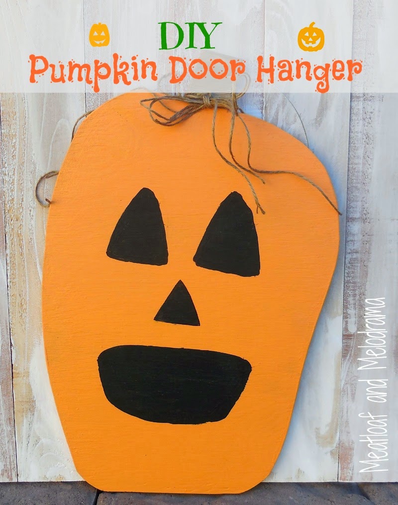 wood pumpkin door hanger with jack o lantern face