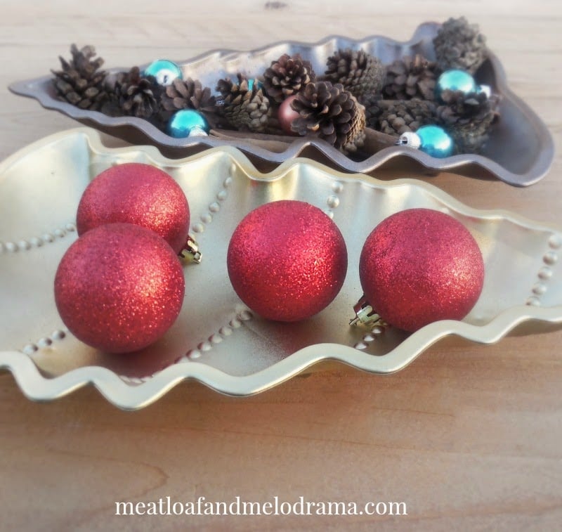 gold and copper christmas tree tray with ornaments, vase filler and cinnamon sticks