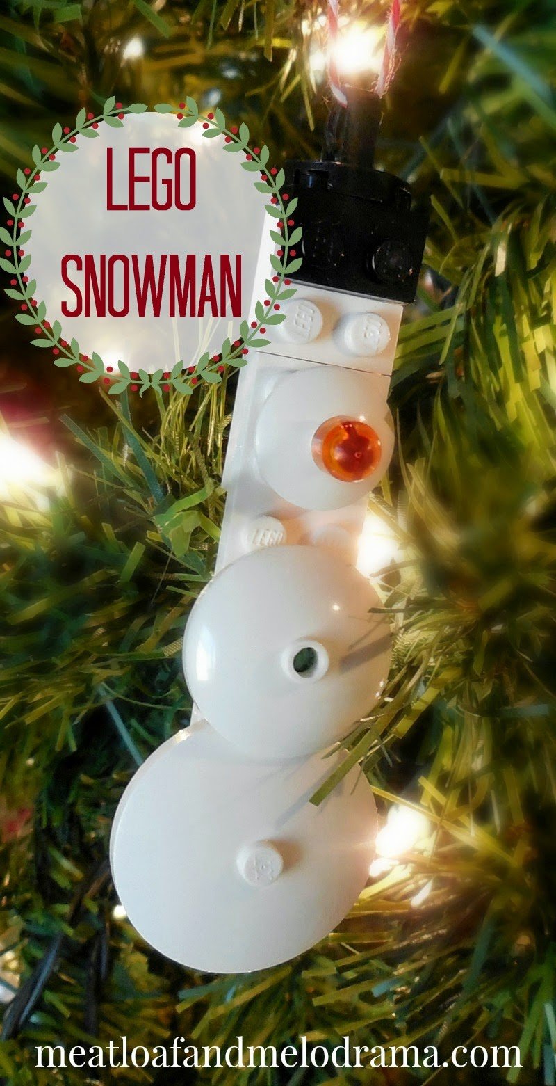 snowman ornament made from legos on a christmas tree