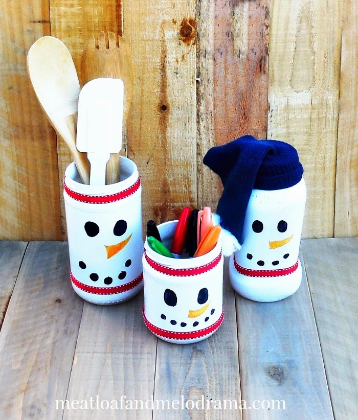 repurporsed spray painted snowman jars holding spoons and markers