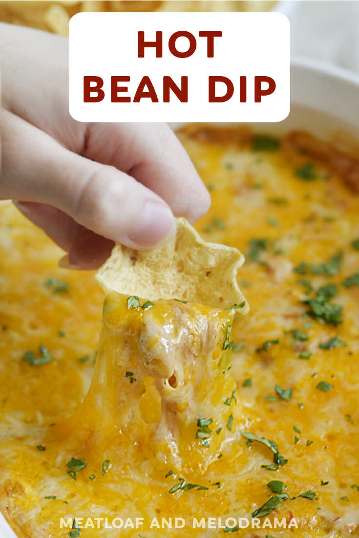 Easy Hot Bean Dip with refried beans, cream cheese, sour cream, salsa and plenty of cheese is a delicious appetizer, snack or side dish! This 5 ingredient dip recipe is perfect for dipping tortilla chips and Fritos! via @meamel