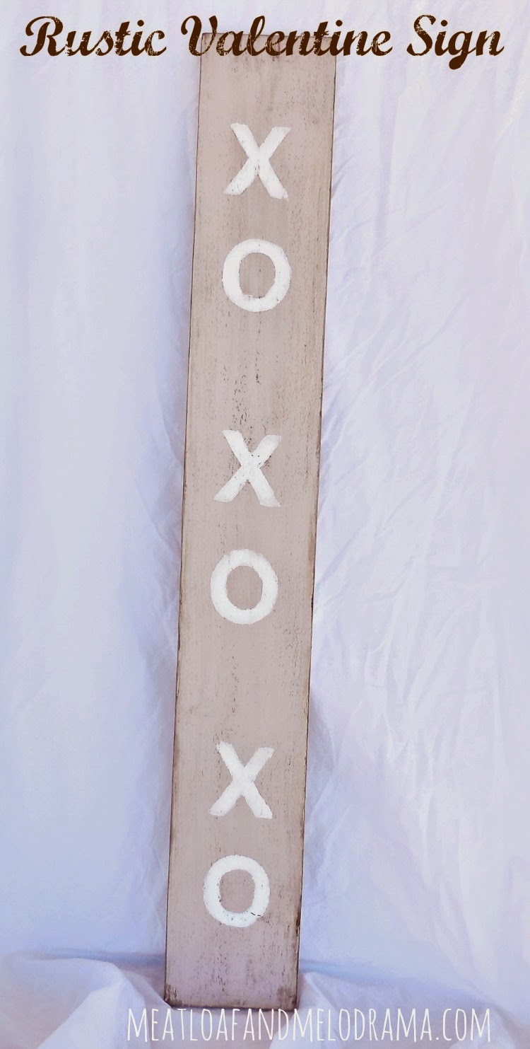 rustic wooden xo xo valentines day sign with chalk paint