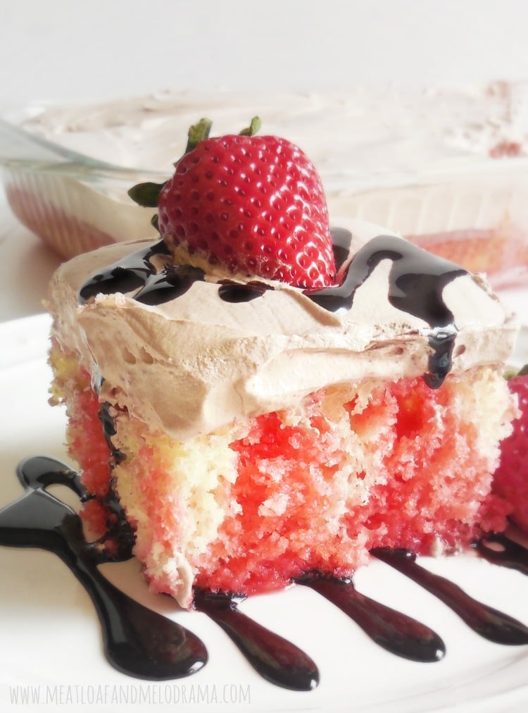 poke cake made with strawberry syrup and chocolate cool whip frosting