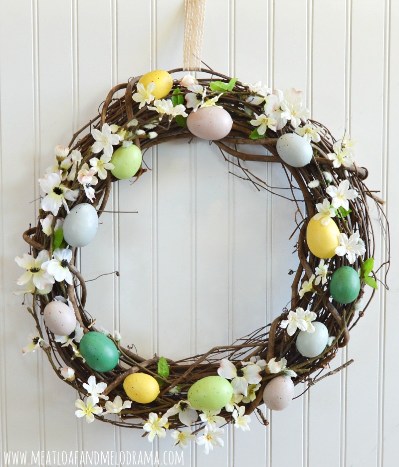 rustic spring wreath with flowers easter eggs and pussy willow branches