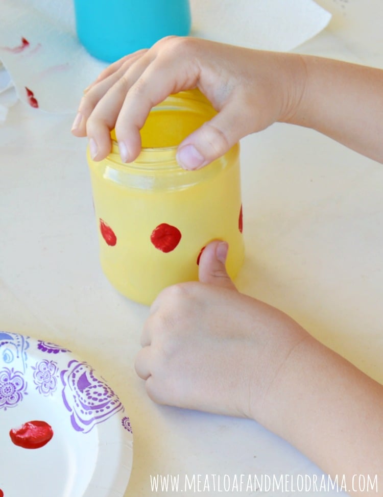 add kids thumbprints for ladybugs with red craft paint