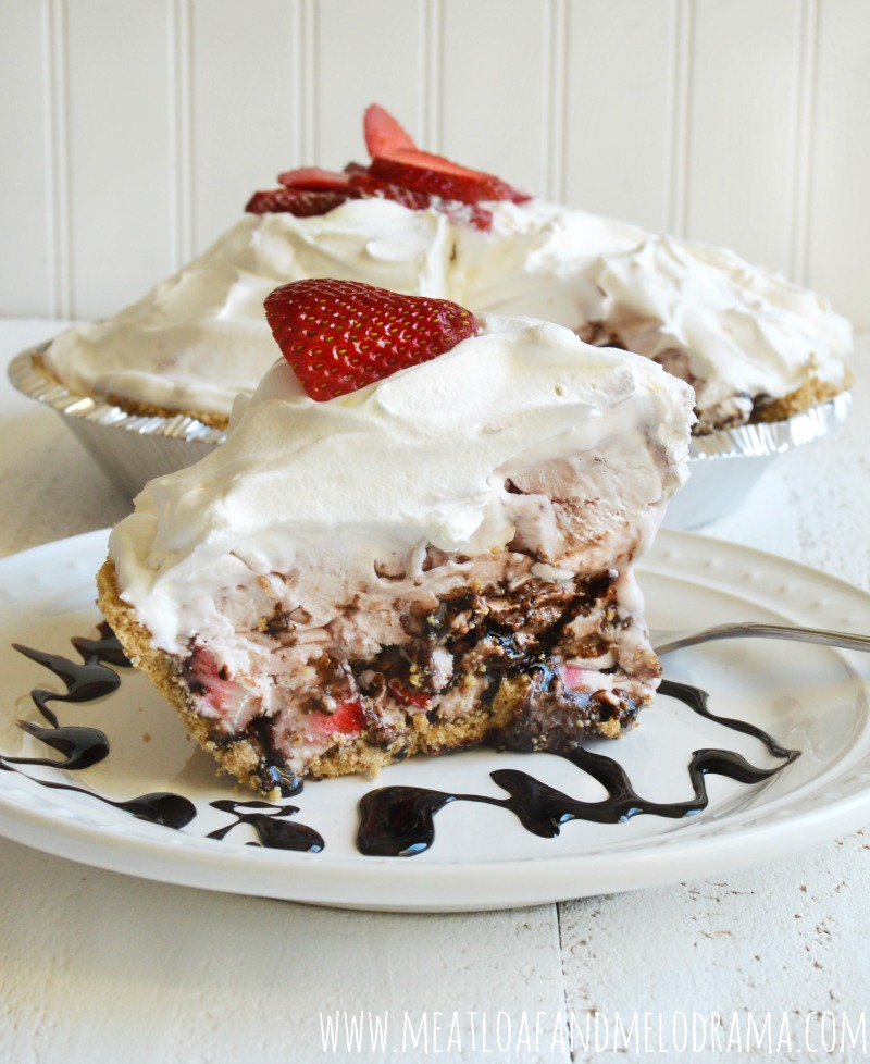 frozen strawberry ice cream pie with whipped topping and strawberry slices