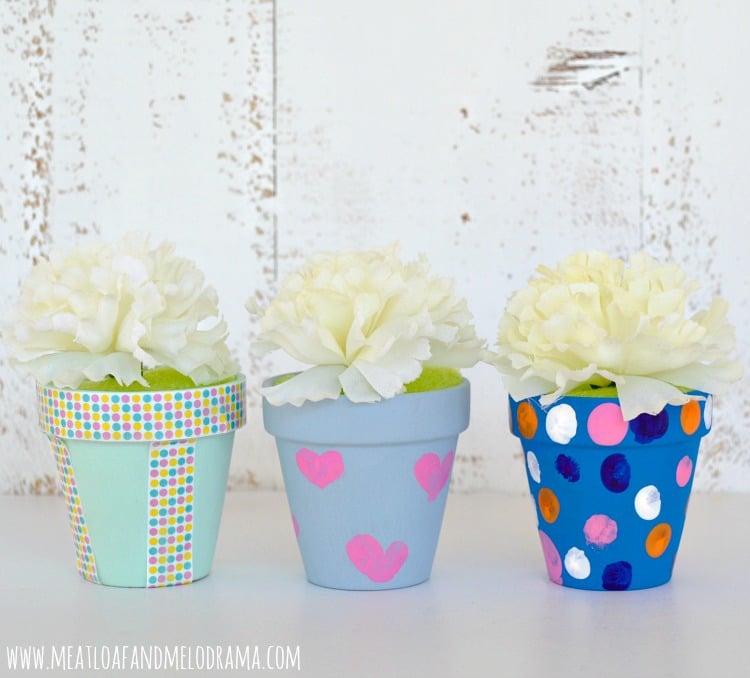 painted flower pots with fingerprints hearts and polka dots and washi tape