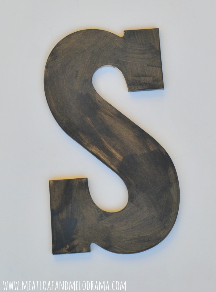 paint graphite on chipboard letter