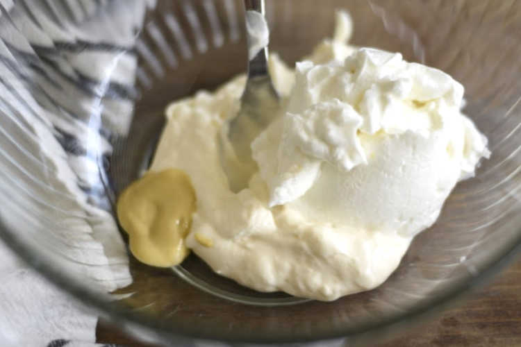 mayo with greek yogurt and mustard in mixing bowl