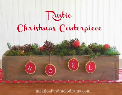 Christmas centerpiece with pine garland and red ornaments