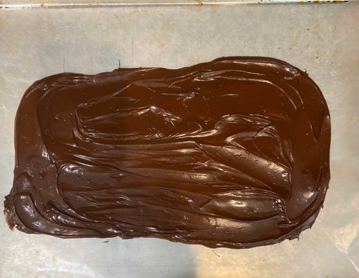 melted chocolate in rectangle shape on cookie sheet