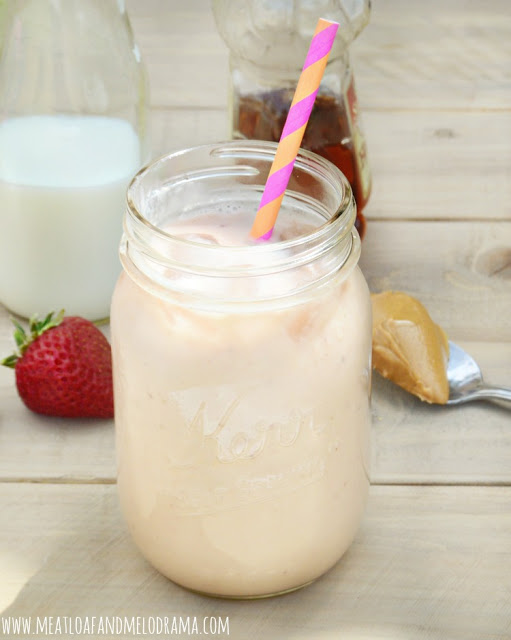 funky monkey smoothie with bananas milk honey strawberries and peanut butter in a mason jar