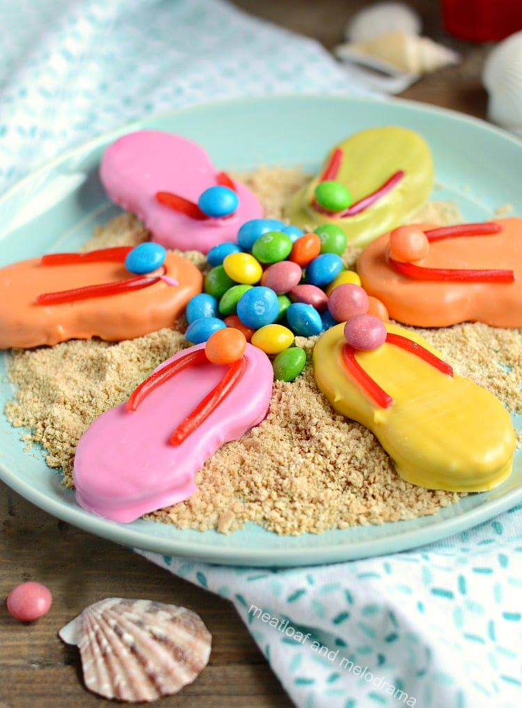 nutter butter easy flip flop cookies with candy melts and skittles and twizzlers on plate with crushed graham crackers