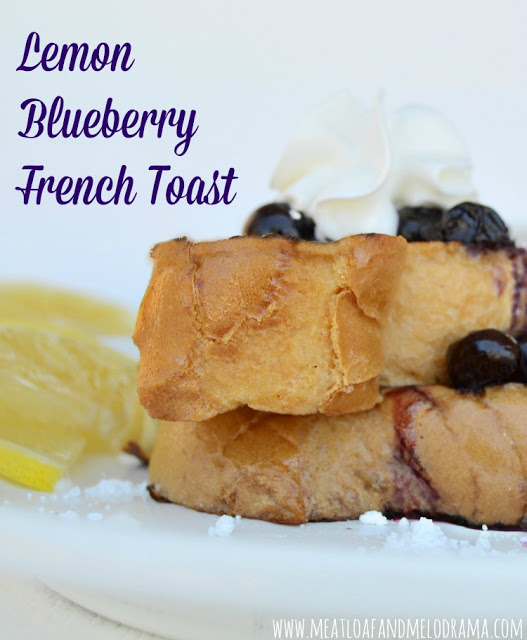 french toast topped with blueberries and slice of lemon
