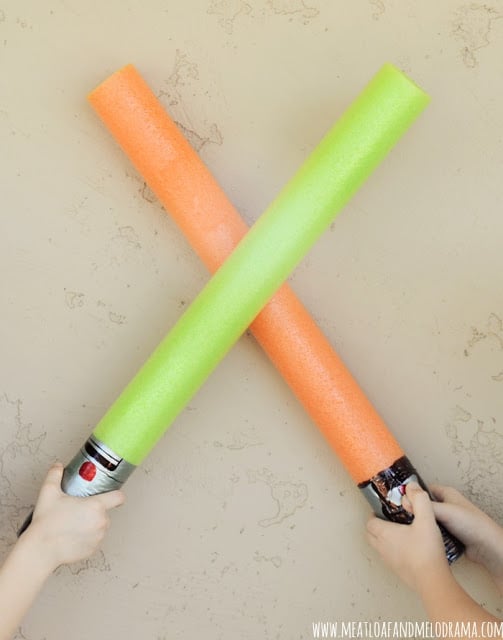 green and orange pool noodle lightsabers for star wars party