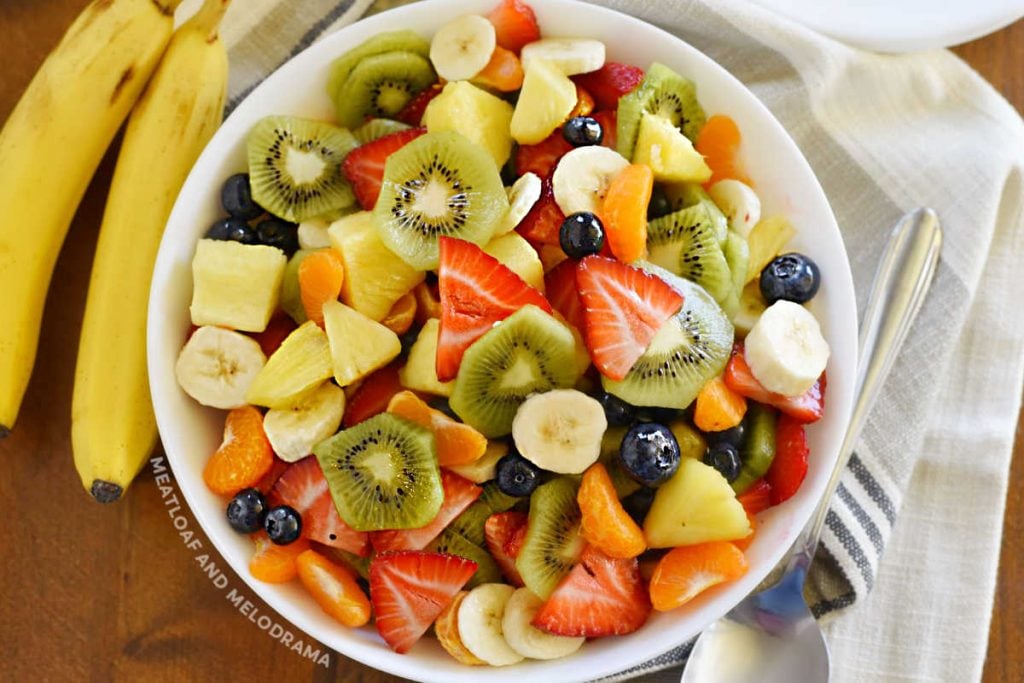 summer fruit salad in white serving bowl