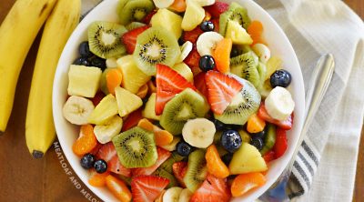 summer fruit salad in white serving bowl