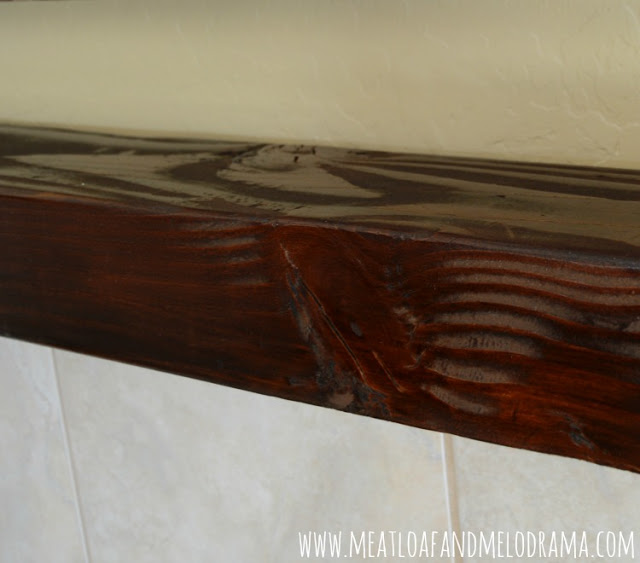 Minwax Dark Walnut stain on wood mantel