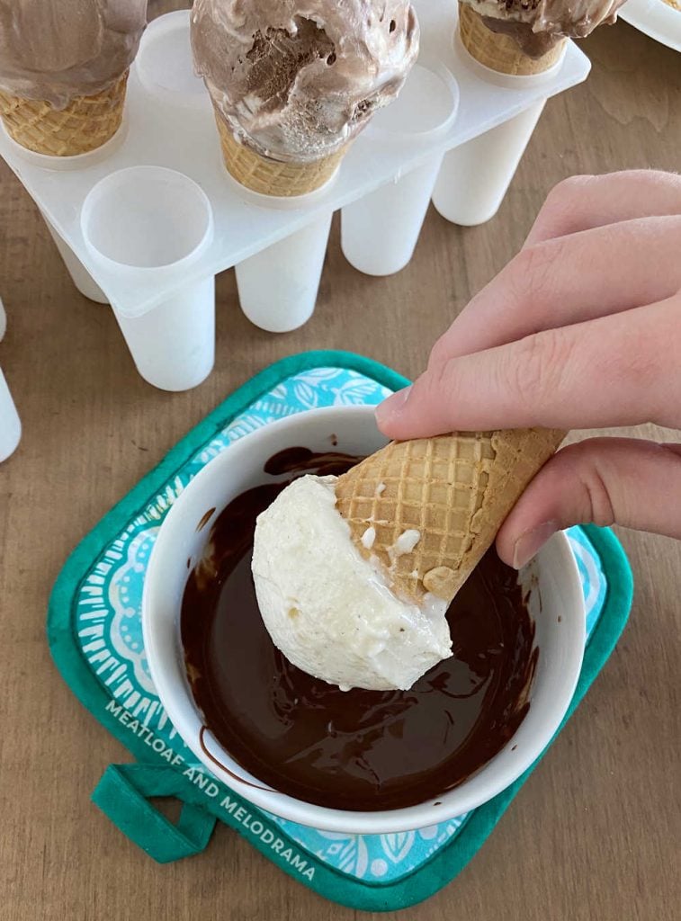 dip ice cream into melted chocolate magic shell