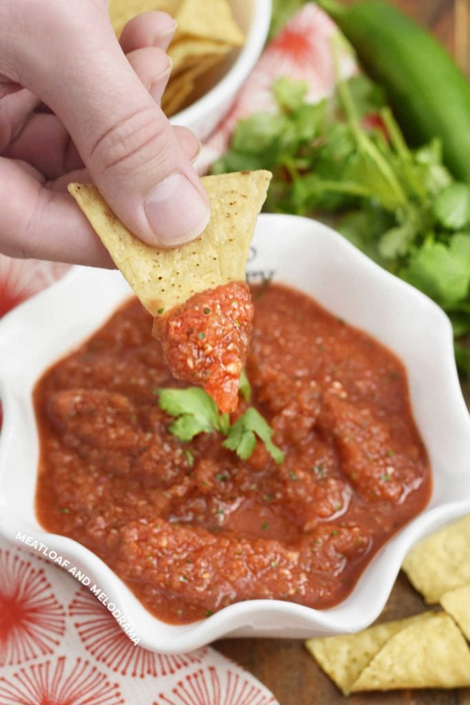 dip tortilla chip in homemade blender salsa from canned tomatoes