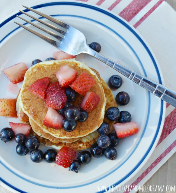 red, white and blueberry pancakes on a plate