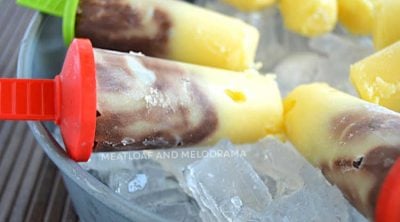swirled vanilla and chocolate jello pudding pops on ice in a bowl