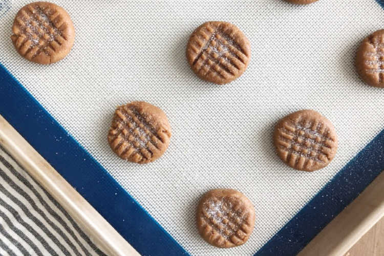 unbaked peanut butter cookies on baking sheet