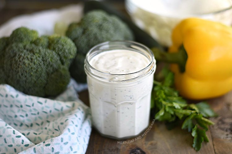 homemade buttermilk ranch dressing in a jar with raw veggies