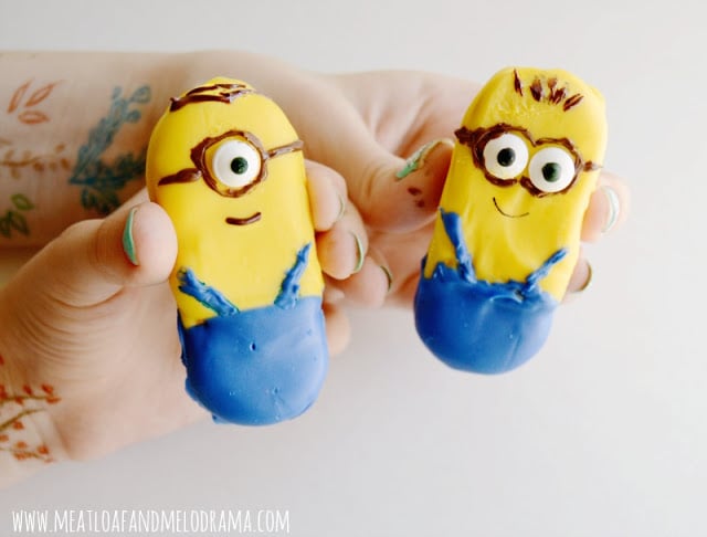 two decorated minion cookies