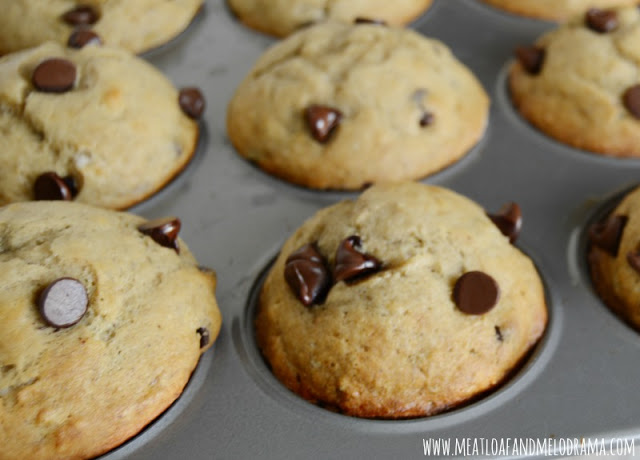 peanut butter banana muffins with melted chocolate chips in a muffin pan