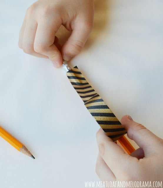 cover wood pencil with strips of washi tape