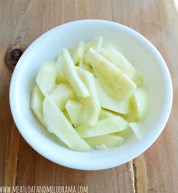 peeled apple slices in a bowl