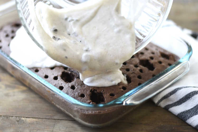 pour oreo pudding over chocolate cake