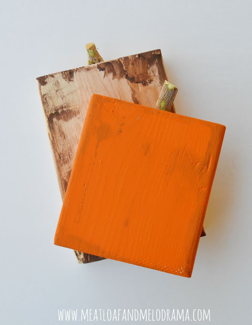 orange and brown paint on rustic wood pumpkins