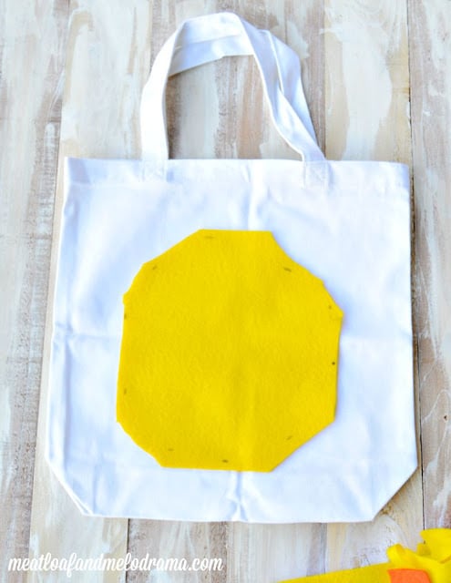 yellow felt and white canvas bag