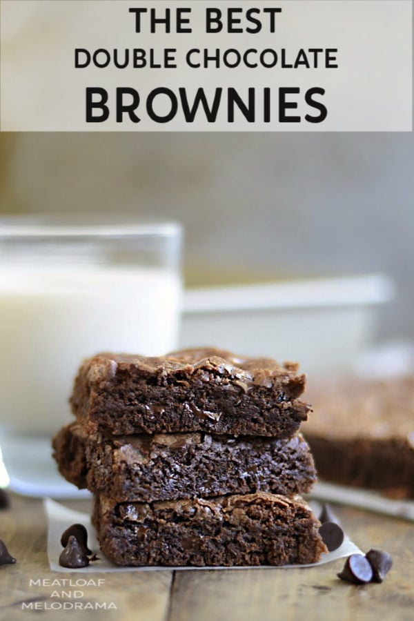 double chocolate brownies stacked with glass of milk