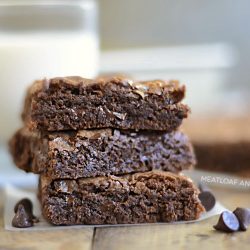 three fudgy chewy double chocolate brownies with chocolate chips brownies stacked
