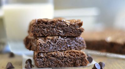 three fudgy chewy double chocolate brownies with chocolate chips brownies stacked