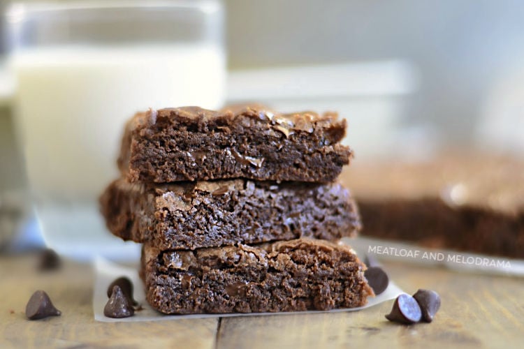 three fudgy chewy double chocolate brownies with chocolate chips brownies stacked