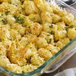 tater tot casserole in a glass baking dish on the table
