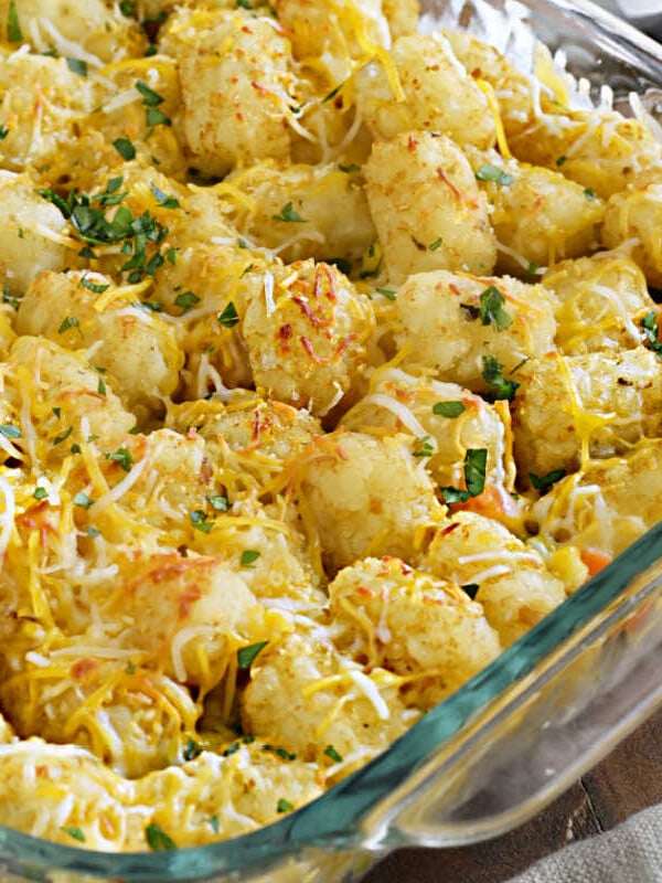 tater tot casserole in a glass baking dish on the table