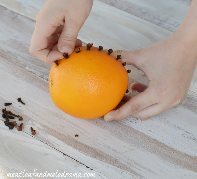 press-cloves-into-oranges